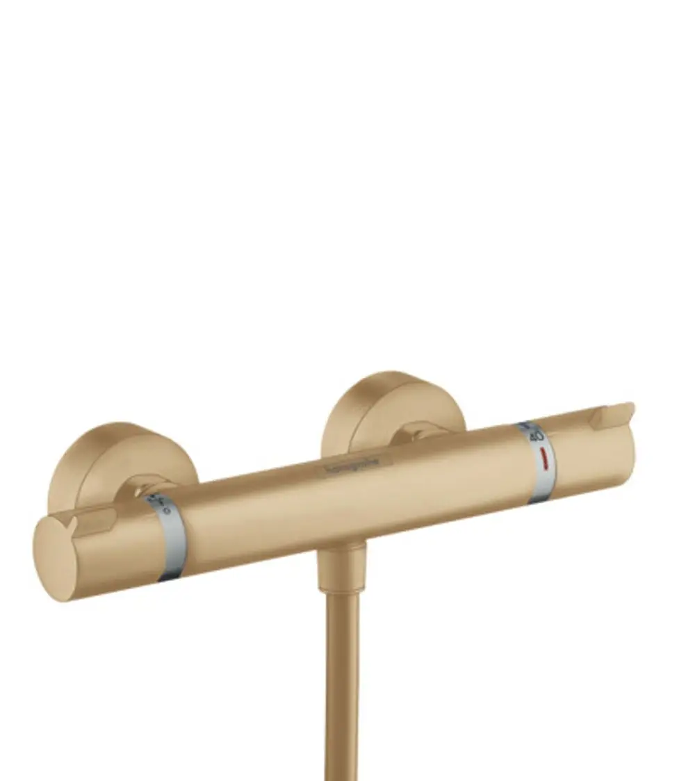 Brausethermostat in gebürsteter Bronze von Hansgrohe, montiert auf einer Wand, mit zwei Temperatureinstellknöpfen und einer Wasserabgabe.